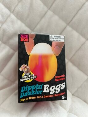 NeeDoh Dippin' Dazzler Color Changing Squishy Egg - Smooth Sunrise